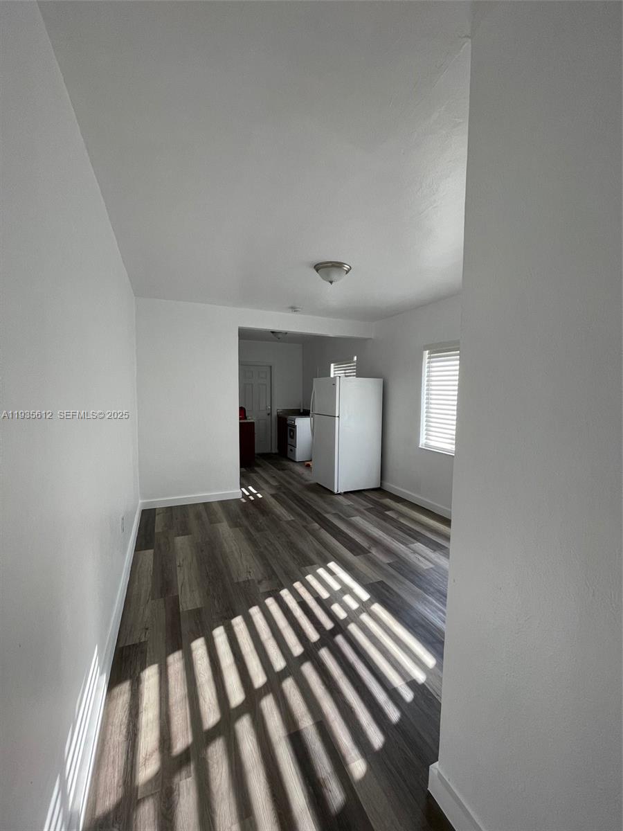 430 Southwest 6th Avenue, Unit 8 Miami, FL 33130 - Photo 2 of 6 a view of a bedroom with wooden floor and bedroom