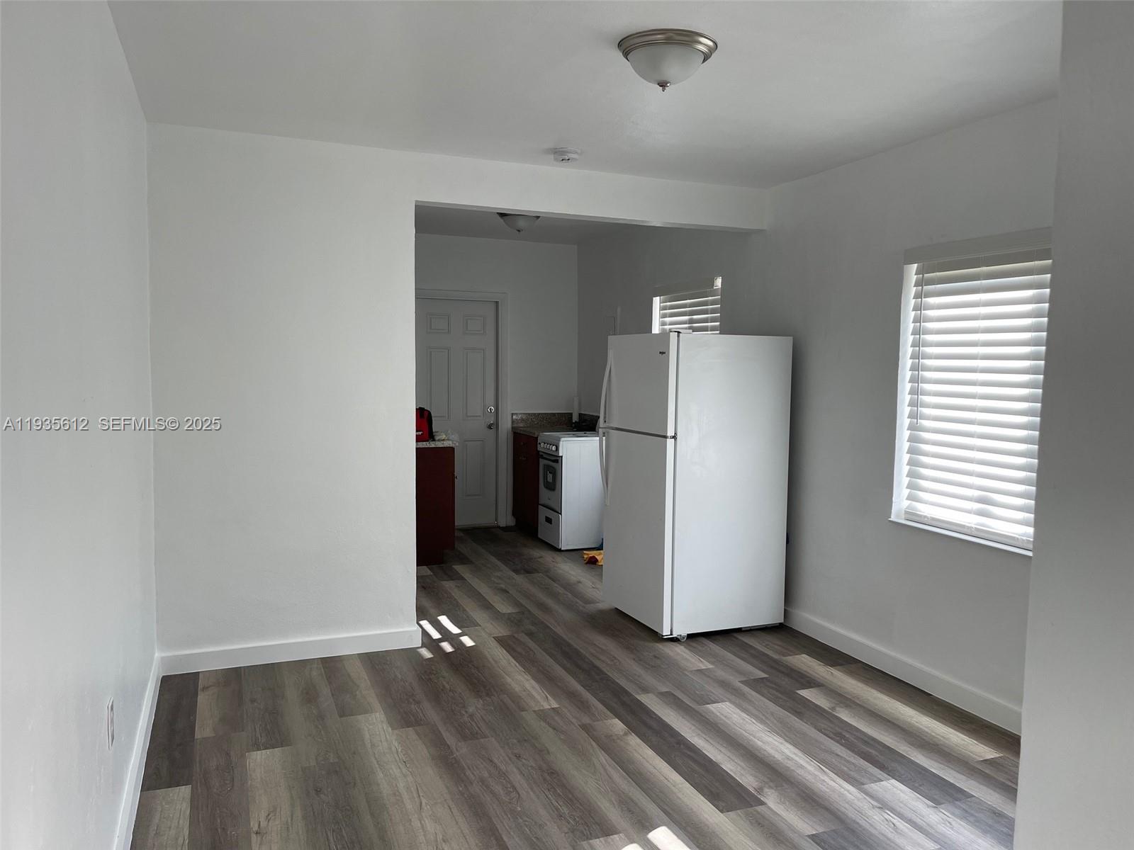 430 Southwest 6th Avenue, Unit 8 Miami, FL 33130 - Photo 3 of 6 a view of a storage & utility room with a window