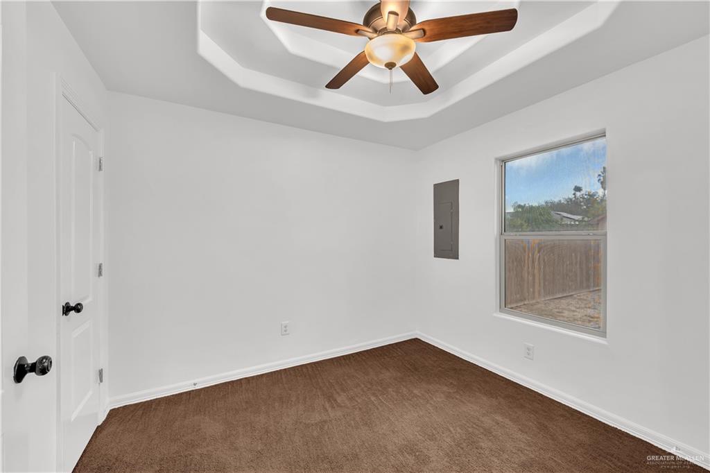 304 Santa Fe Street Alton, TX 78573 - Photo 19 of 31 an empty room with fan and windows