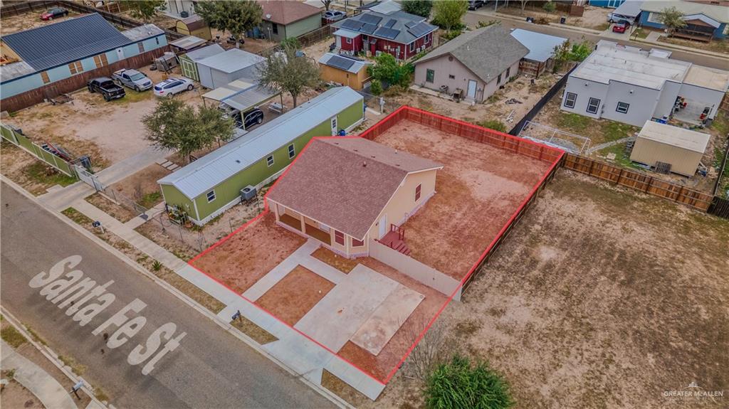 304 Santa Fe Street Alton, TX 78573 - Photo 26 of 31 an aerial view of a house with a yard