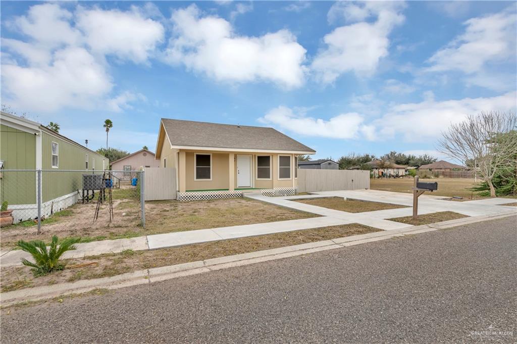 304 Santa Fe Street Alton, TX 78573 - Photo 3 of 31 a front view of a house with a garage