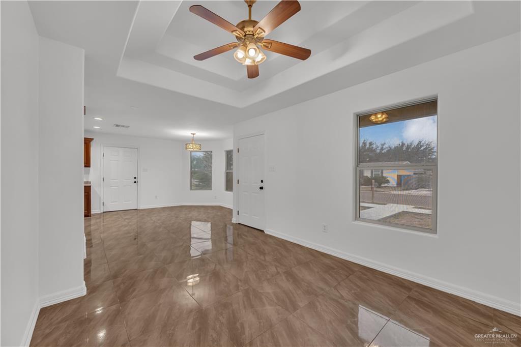 304 Santa Fe Street Alton, TX 78573 - Photo 31 of 31 a view of an empty room with window and a ceiling fan