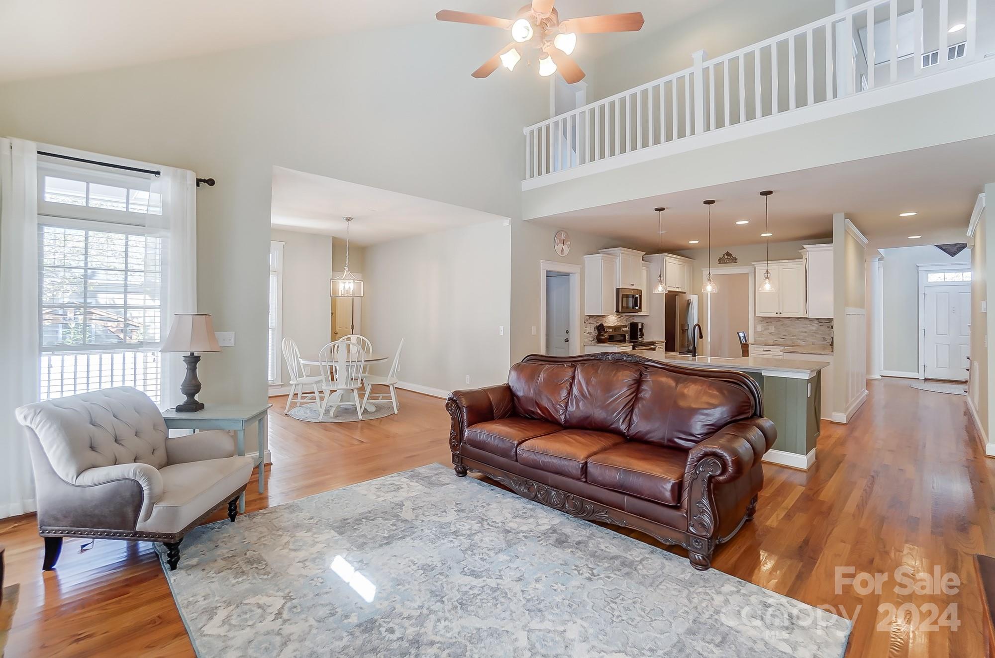 169 Mills Lane Fort Mill, SC 29708 - Photo 12 of 38 a living room with furniture and a wooden floor