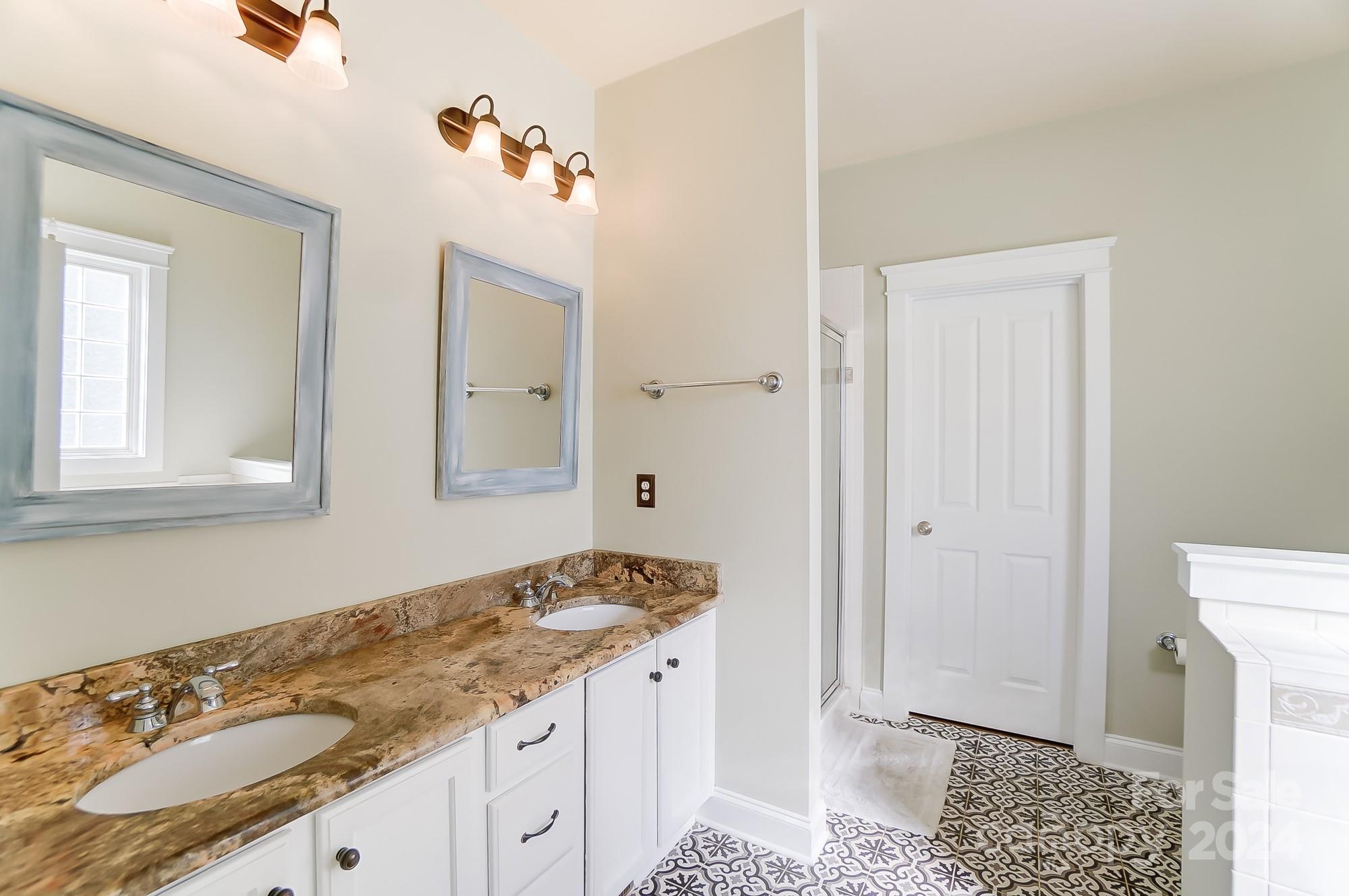 169 Mills Lane Fort Mill, SC 29708 - Photo 18 of 38 a bathroom with a granite countertop sink and a mirror