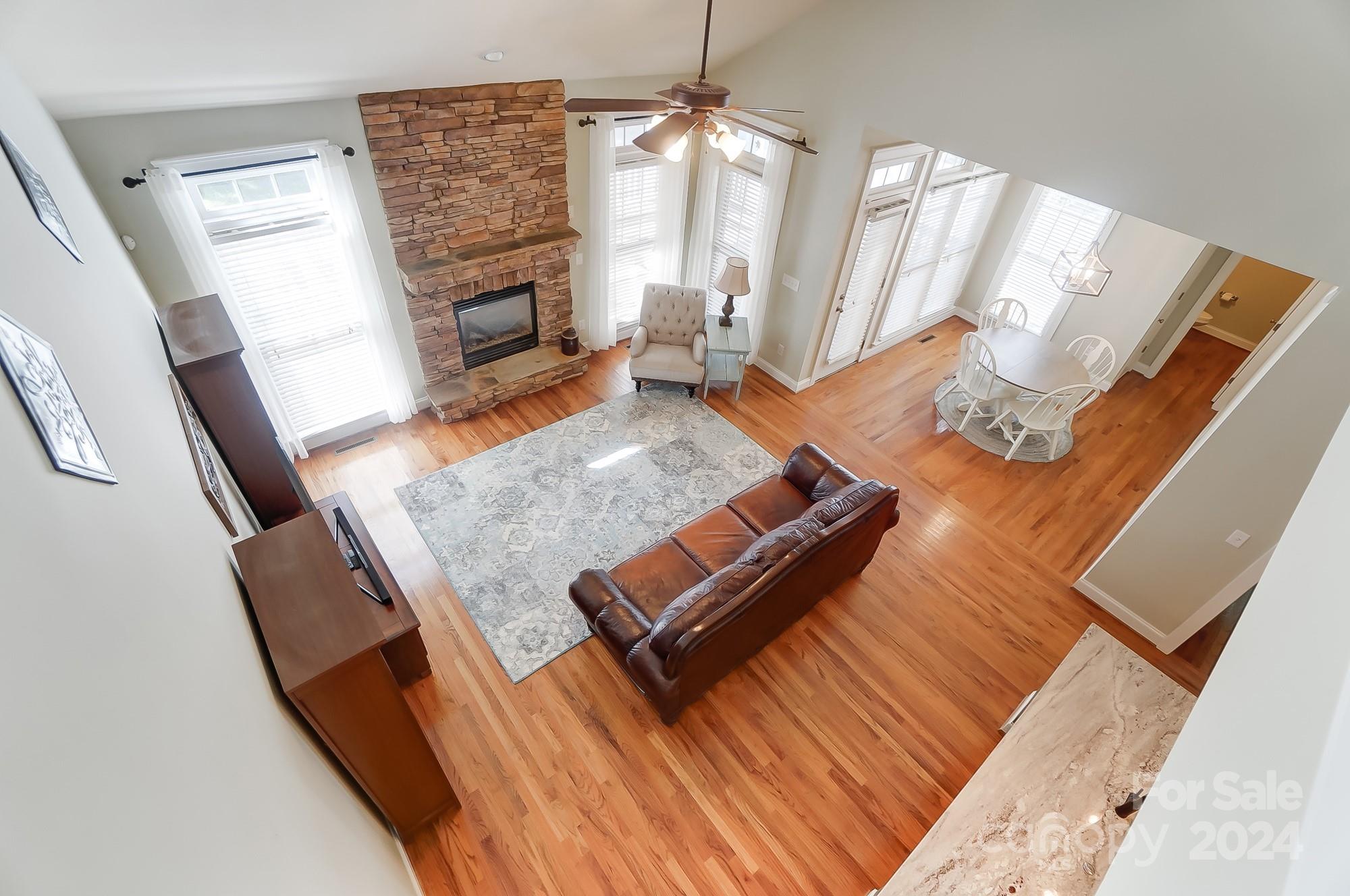 169 Mills Lane Fort Mill, SC 29708 - Photo 23 of 38 a living room with furniture rug and a fireplace