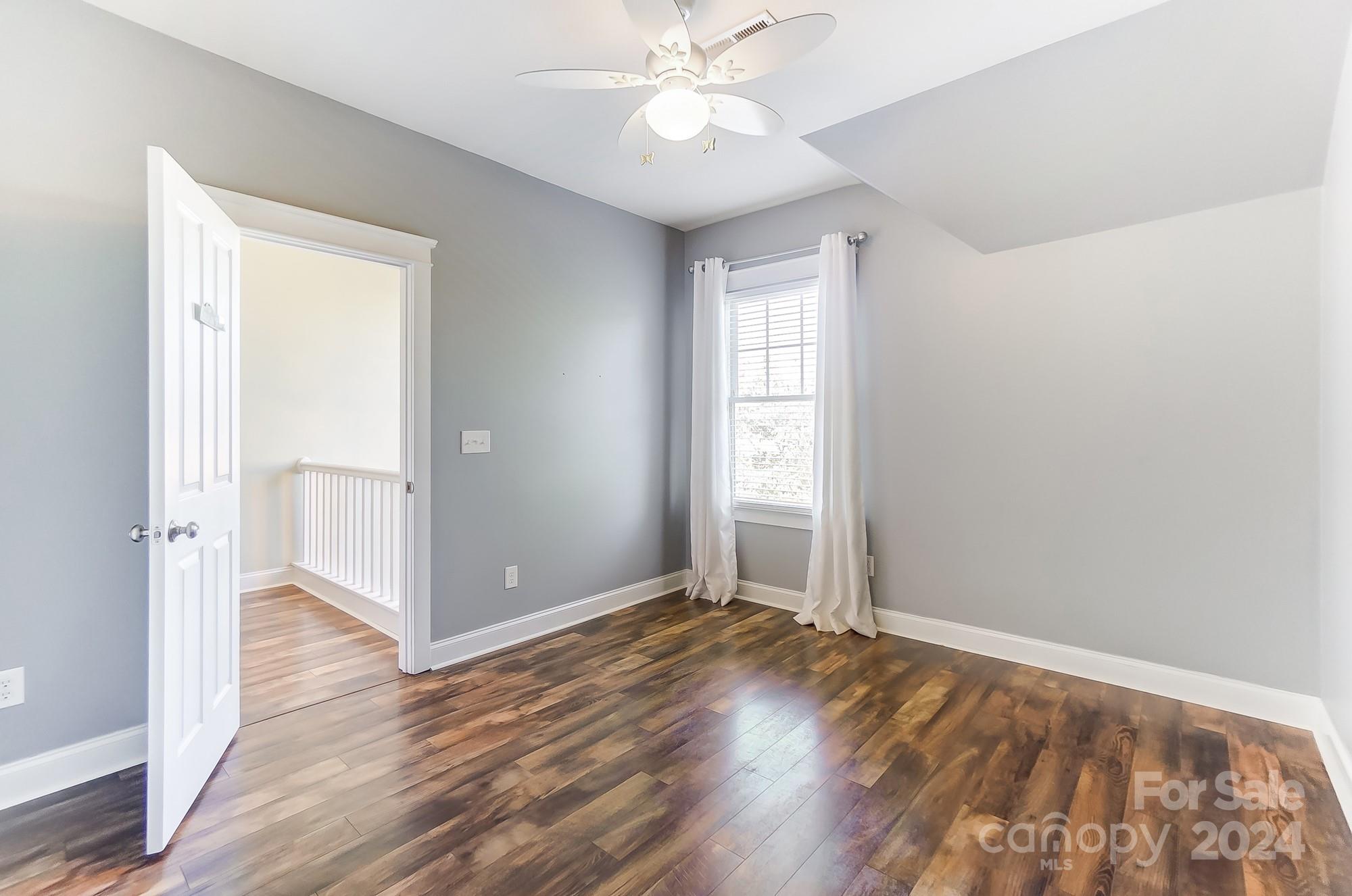 169 Mills Lane Fort Mill, SC 29708 - Photo 29 of 38 wooden floor in an empty room with a window