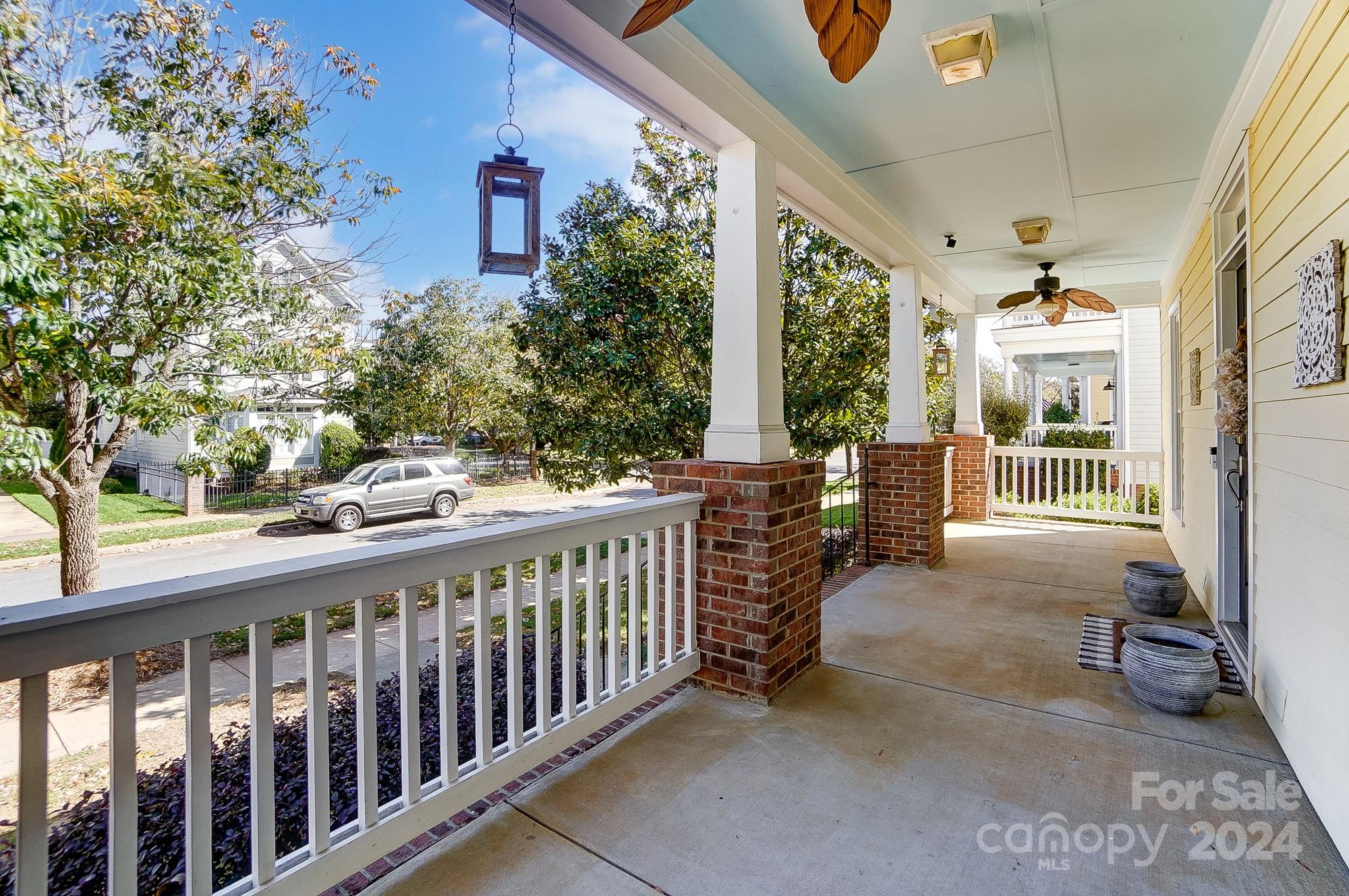 169 Mills Lane Fort Mill, SC 29708 - Photo 3 of 38 a view of a porch with a table and chairs