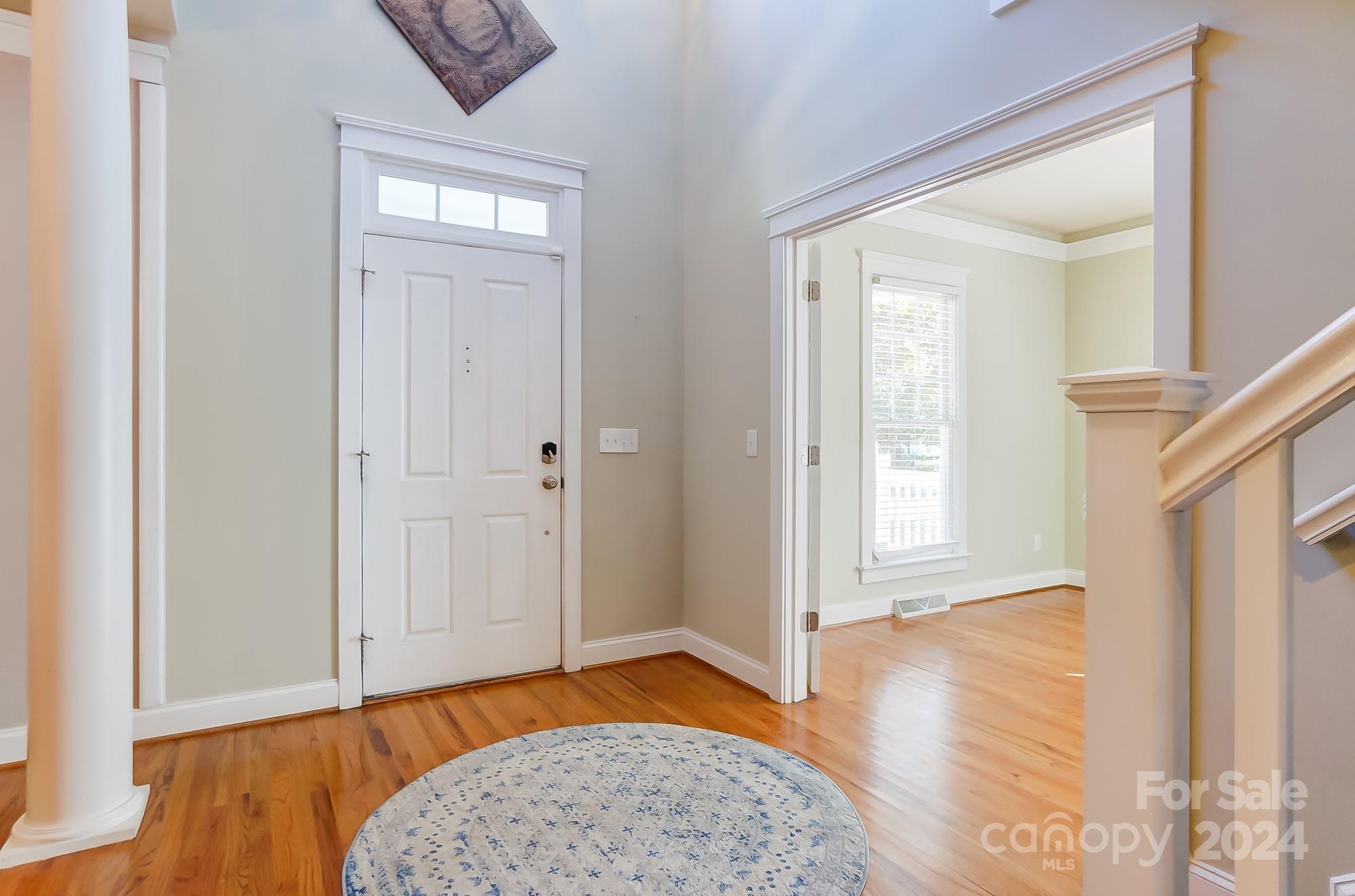 169 Mills Lane Fort Mill, SC 29708 - Photo 4 of 38 an empty room with wooden floor and a window