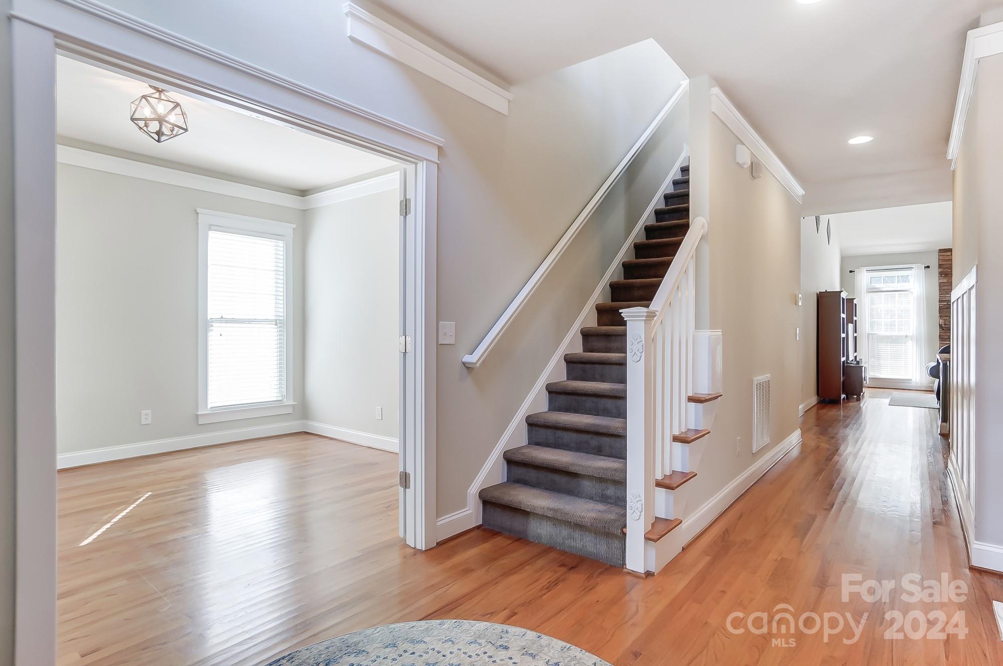 169 Mills Lane Fort Mill, SC 29708 - Photo 5 of 38 a view of entryway and hall with wooden floor