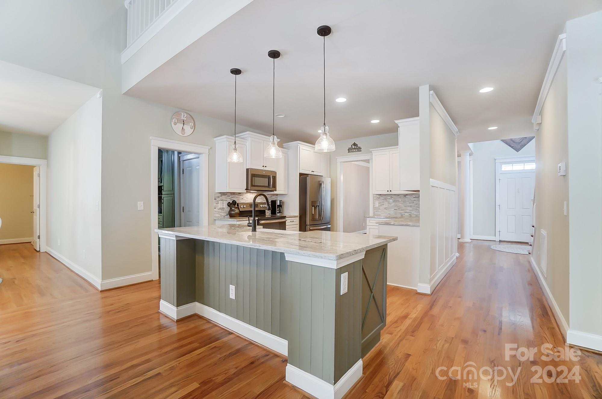 169 Mills Lane Fort Mill, SC 29708 - Photo 8 of 38 a large kitchen with lots of counter space a sink appliances and cabinets