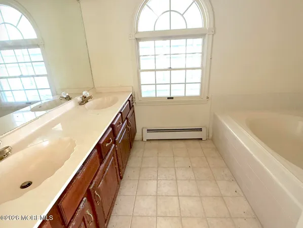 a bathroom with a sink and a bathtub