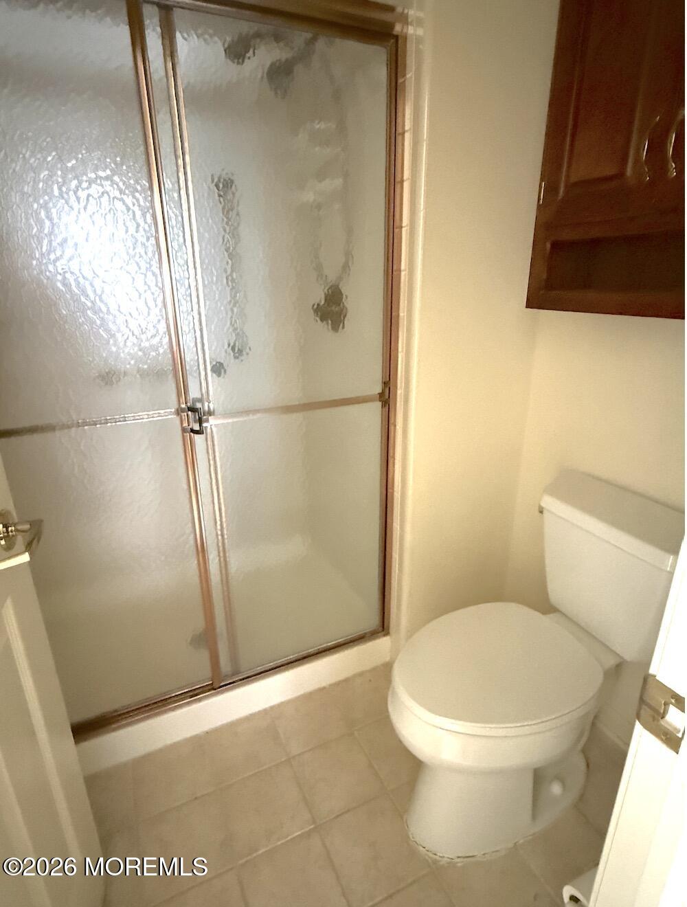 1575 Goldspire Road Toms River, NJ 08755 - Photo 15 of 16 a white toilet sitting next to a shower