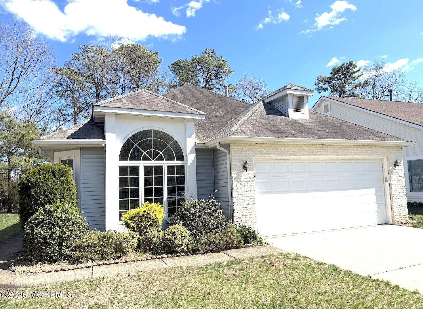 1575 Goldspire Road Toms River, NJ 08755 - Photo 2 of 16 a front view of a house with garden