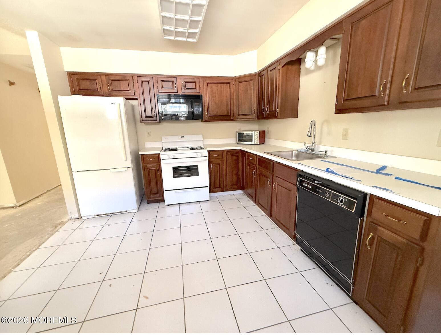 1575 Goldspire Road Toms River, NJ 08755 - Photo 9 of 16 a kitchen with stainless steel appliances granite countertop a stove a sink dishwasher and a refrigerator