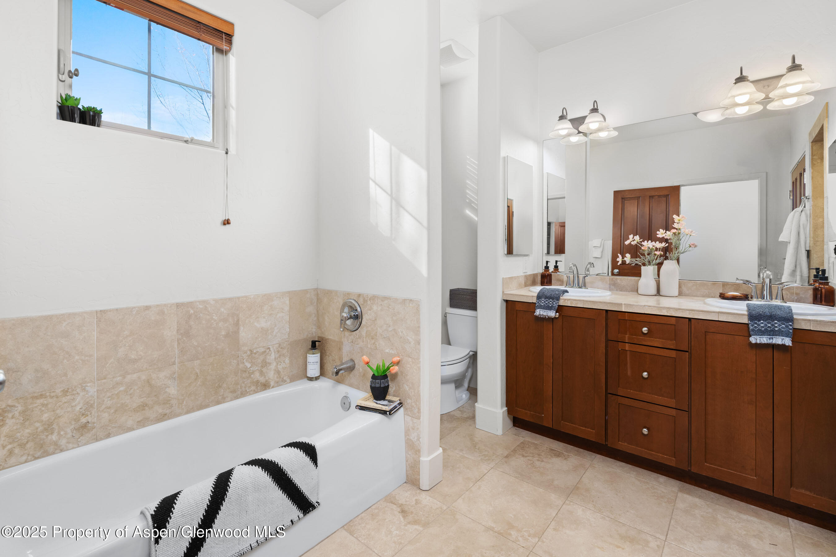 435 Jody Road Basalt, CO 81621 - Photo 16 of 29 a bathroom with a tub sink and mirror