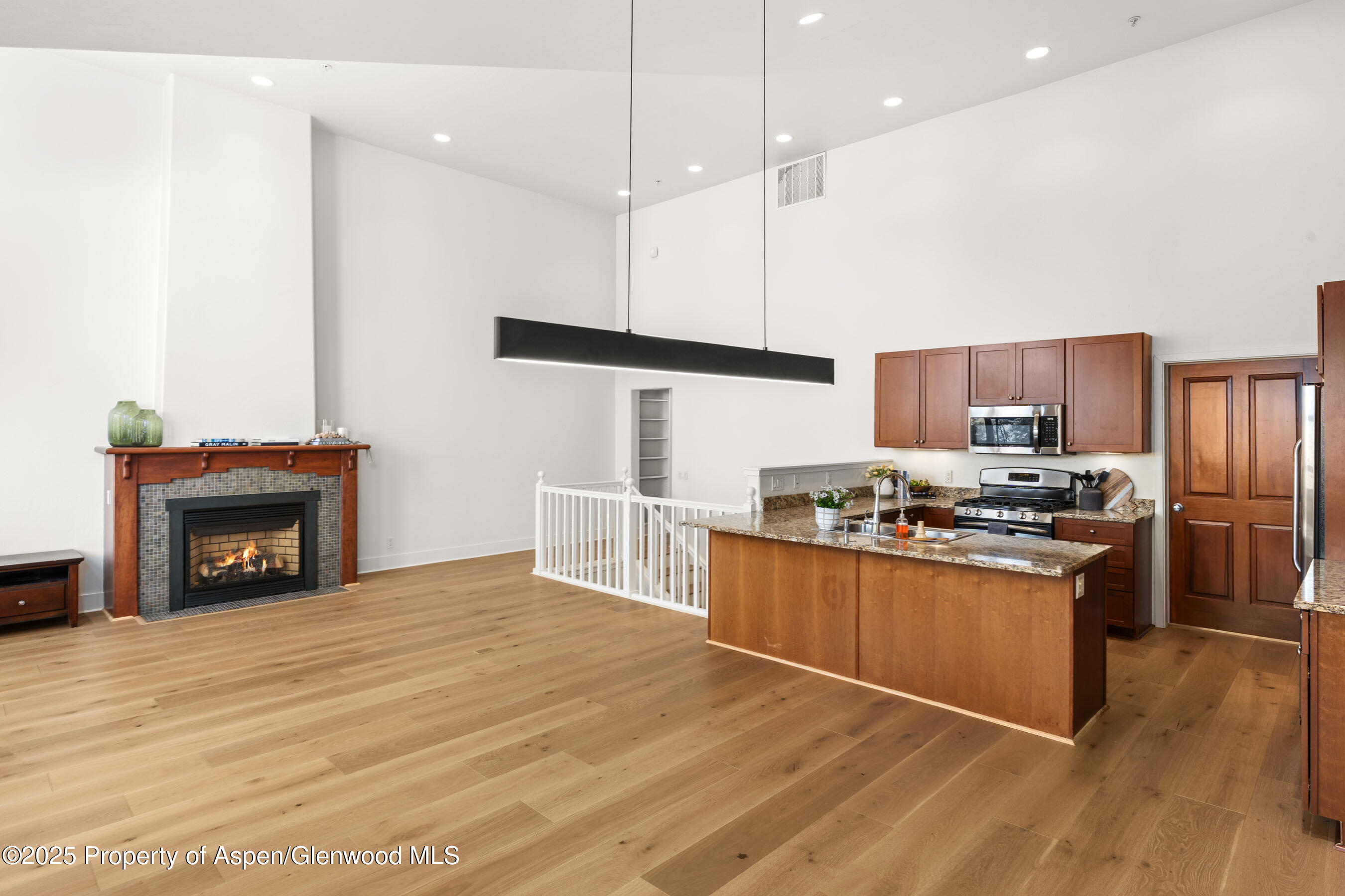 435 Jody Road Basalt, CO 81621 - Photo 6 of 29 a kitchen with stainless steel appliances granite countertop a stove a refrigerator a sink and a wooden floor