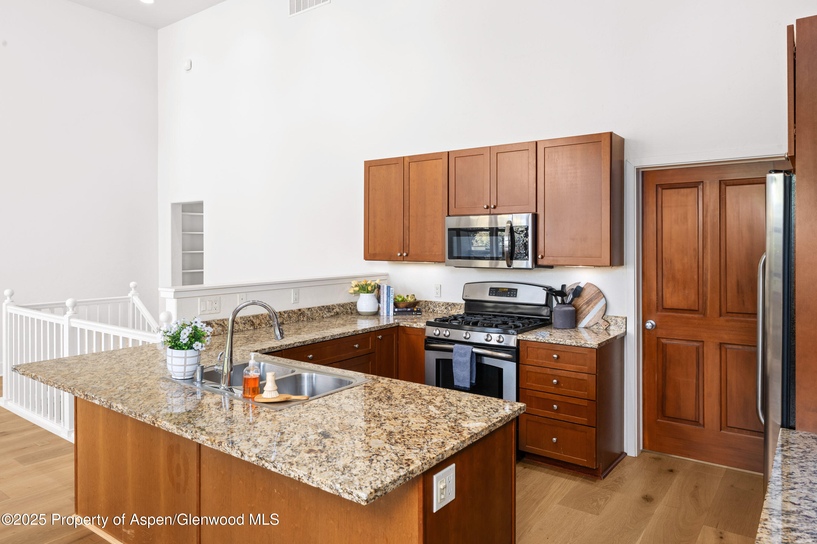 435 Jody Road Basalt, CO 81621 - Photo 9 of 29 a kitchen with stainless steel appliances granite countertop a sink stove and refrigerator