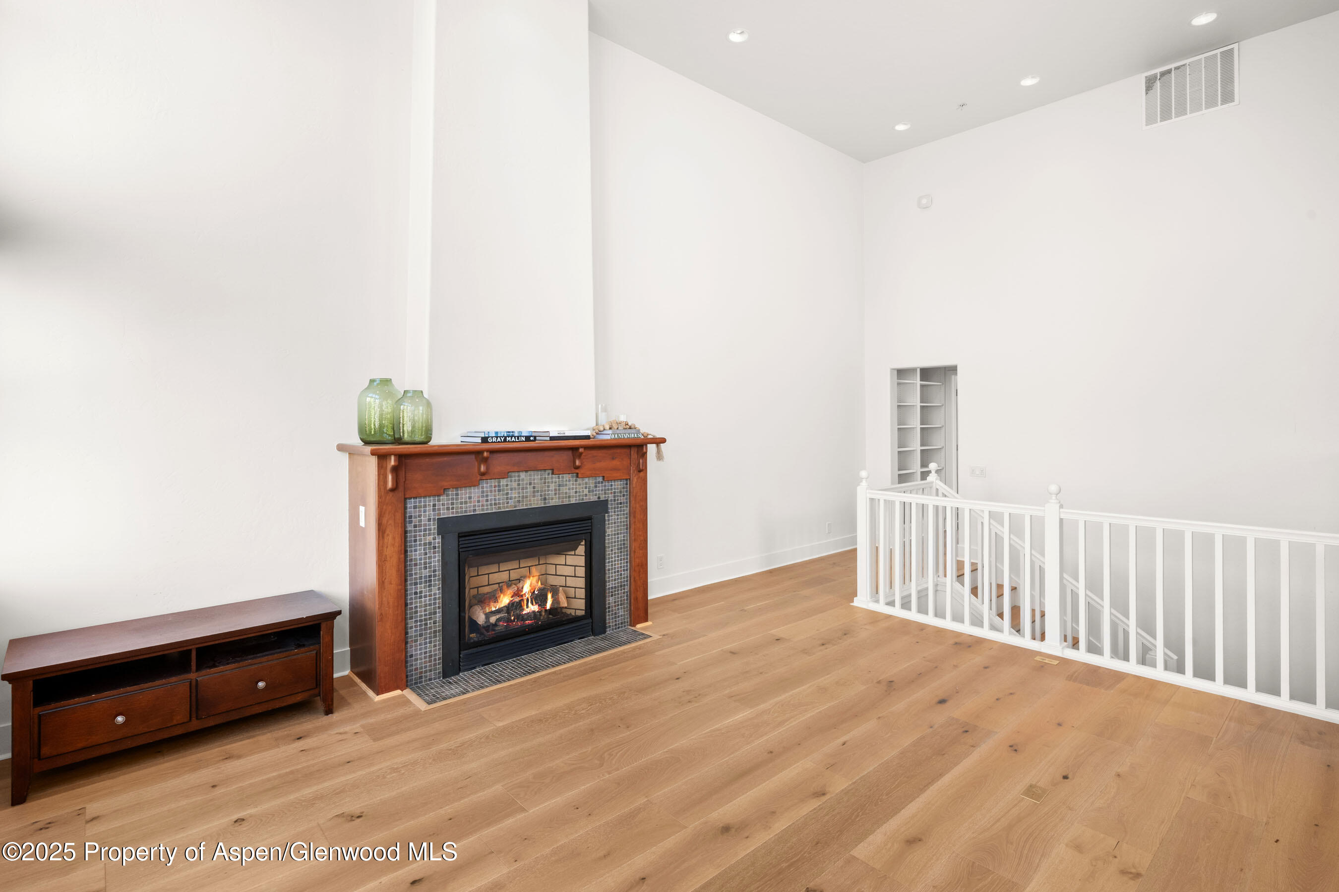 435 Jody Road Basalt, CO 81621 - Photo 10 of 29 a view of an empty room with wooden floor and fireplace