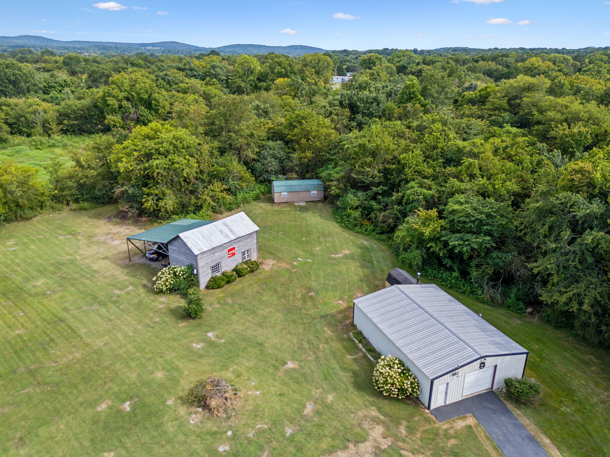 2251 Phillips Road Lebanon, TN 37087 - Photo 39 of 41 a view of a backyard with plants and a garden