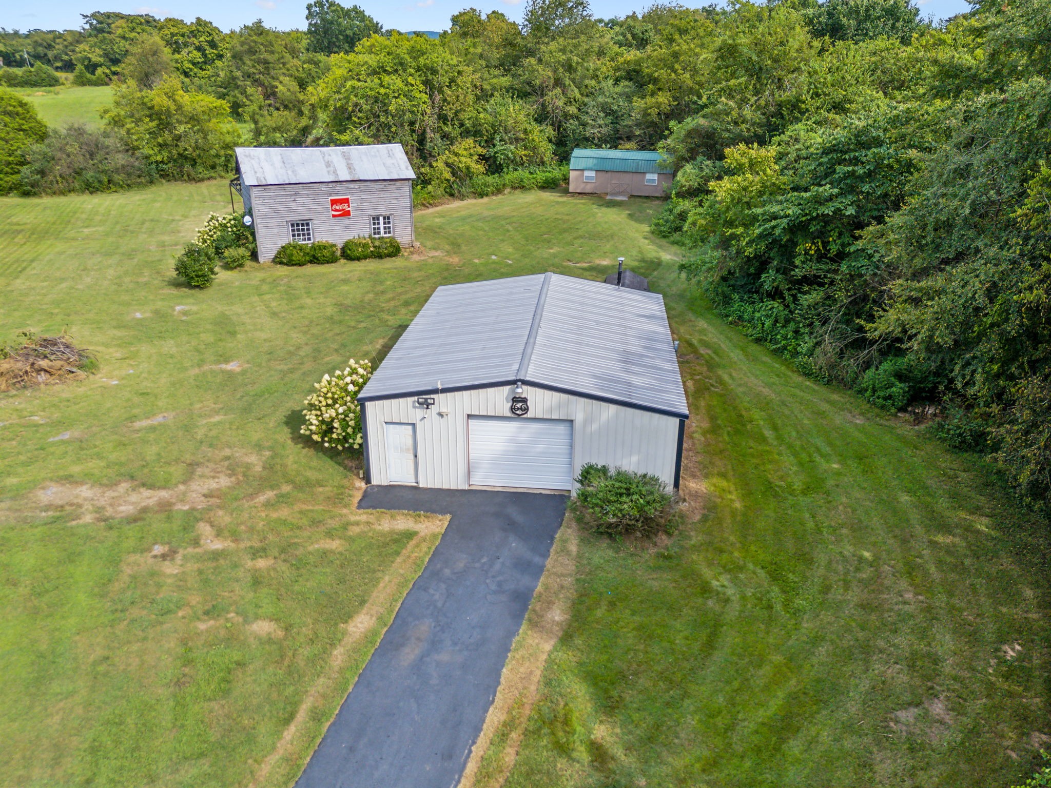 2251 Phillips Road Lebanon, TN 37087 - Photo 4 of 41 an aerial view of a house with pool big yard and large trees