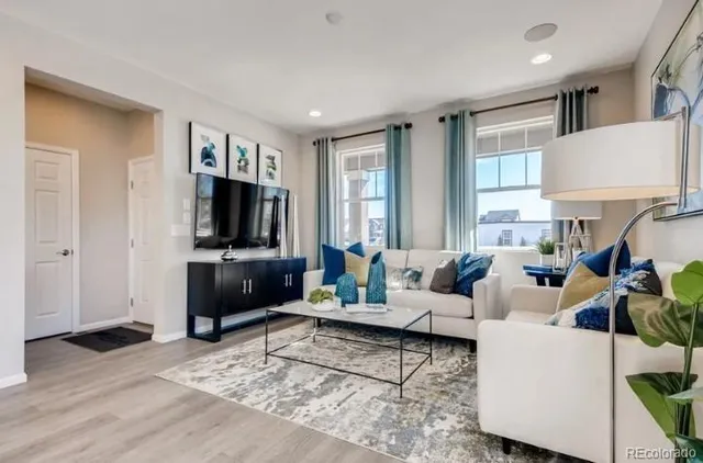 a view of a livingroom with furniture and window