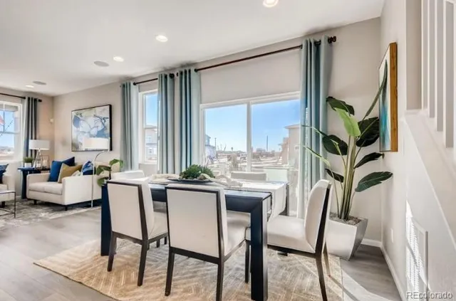 a bathroom with a granite countertop sink a mirror and shower