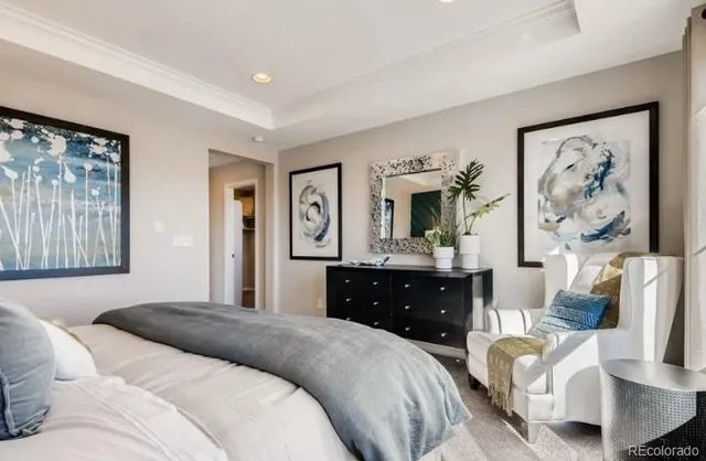 a bathroom with a sink a mirror and next to a window
