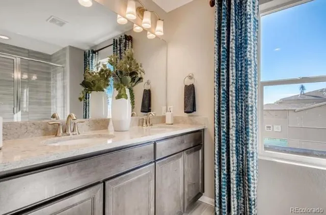 an aerial view of a house with swimming pool garden and lake view