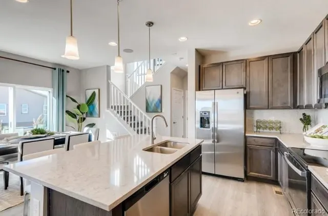 a bedroom with a bed and large windows