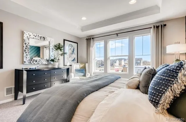 a kitchen with stainless steel appliances kitchen island granite countertop a table chairs and a refrigerator