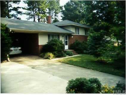 5032 Newcastle Road Raleigh, NC 27606 - Photo 1 of 1 a front view of a house with a yard