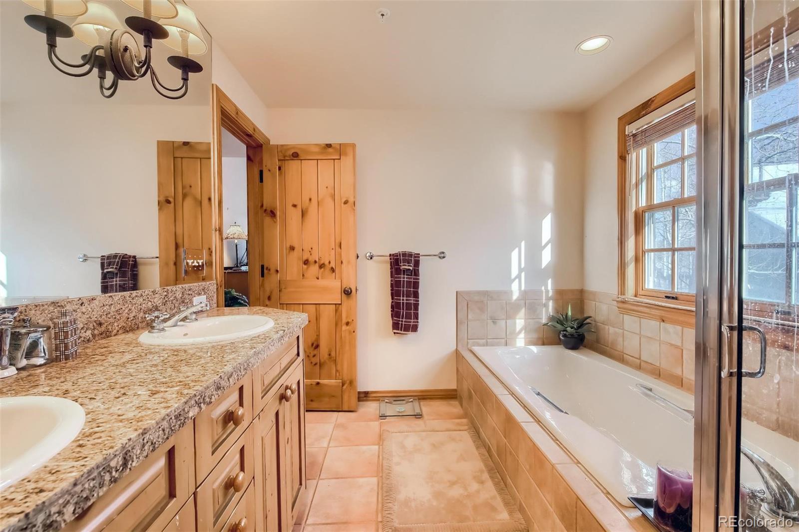5 Fairway Lane Edwards, CO 81632 - Photo 12 of 34 a spacious bathroom with a tub sink and mirror