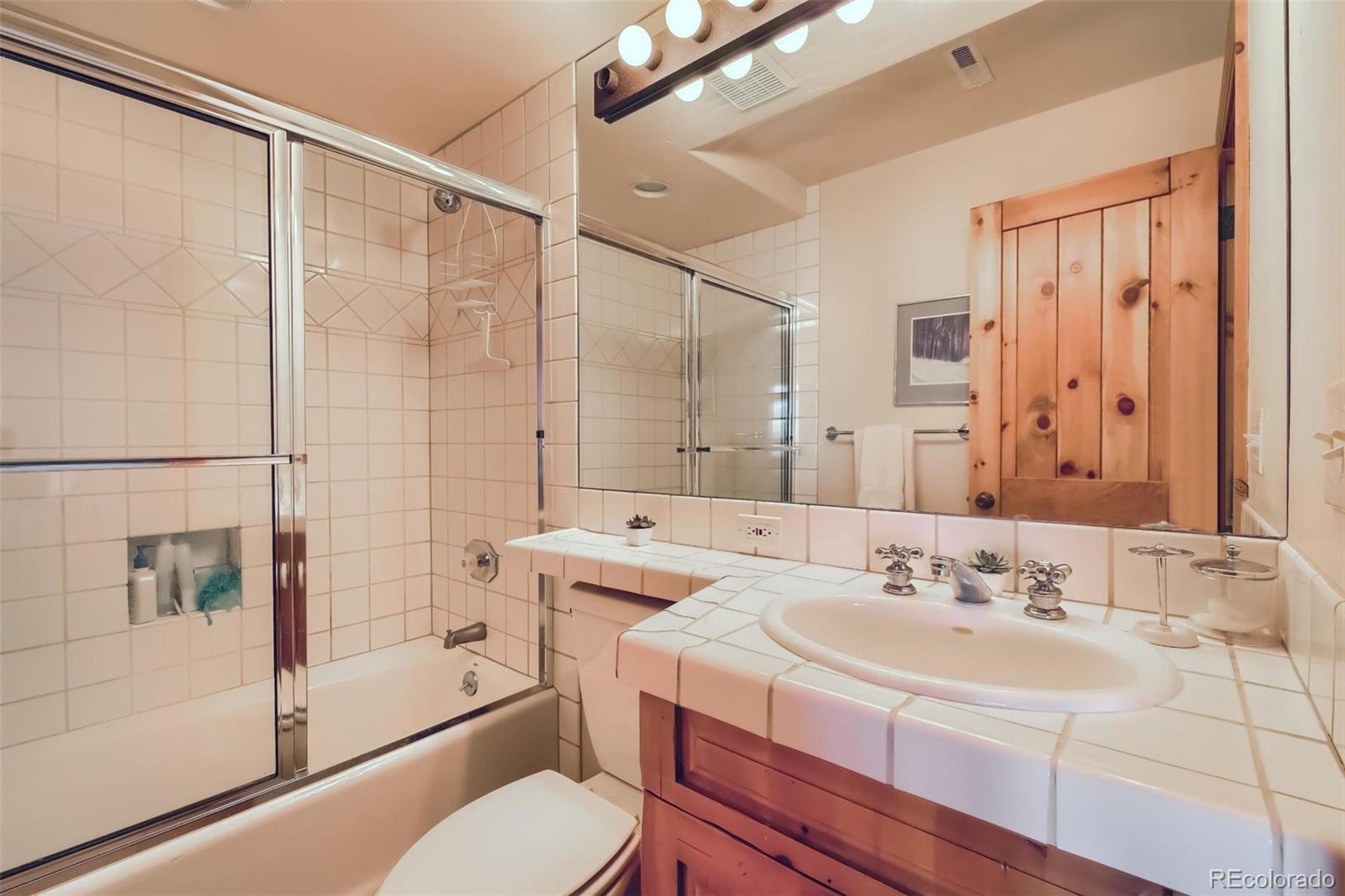 5 Fairway Lane Edwards, CO 81632 - Photo 16 of 34 a bathroom with a sink toilet and shower