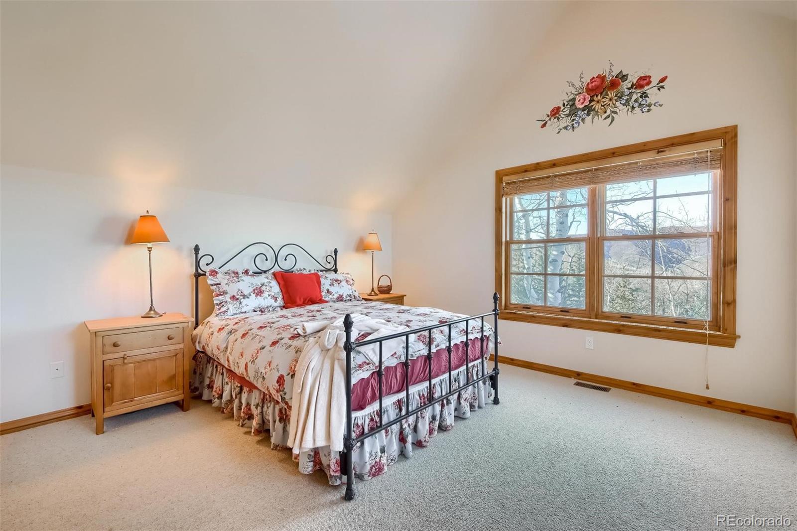 5 Fairway Lane Edwards, CO 81632 - Photo 17 of 34 a bedroom with a bed and a window