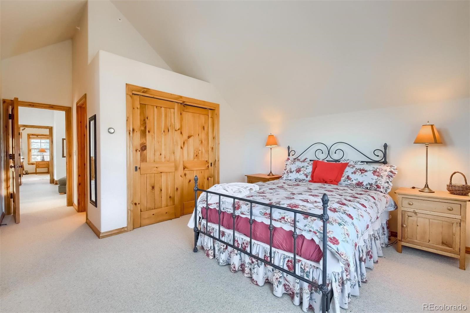 5 Fairway Lane Edwards, CO 81632 - Photo 18 of 34 a bedroom with a bed and a table