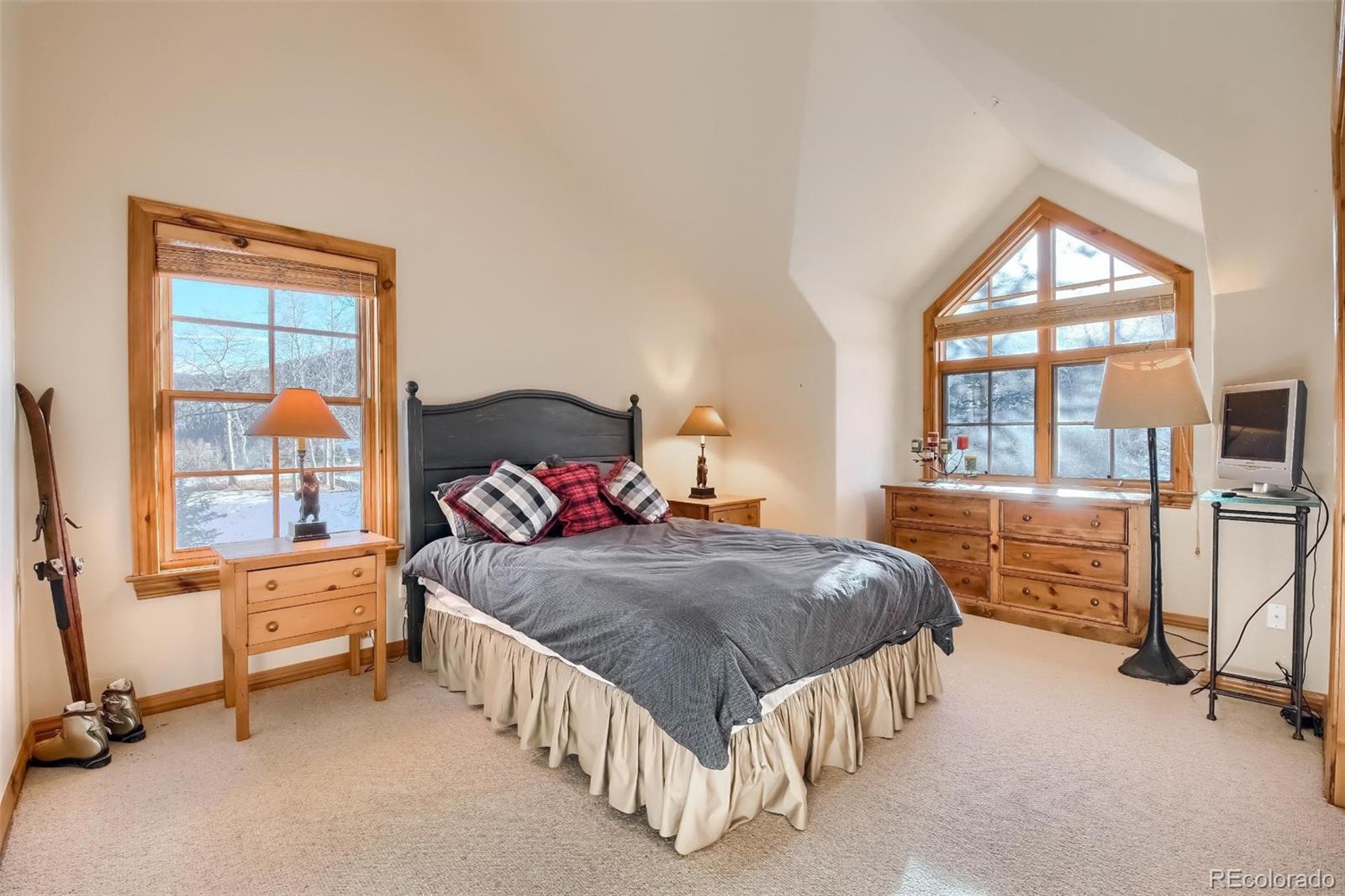 5 Fairway Lane Edwards, CO 81632 - Photo 19 of 34 a bedroom with a bed and a window