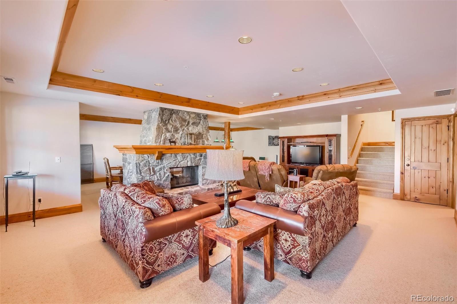 5 Fairway Lane Edwards, CO 81632 - Photo 23 of 34 a living room with furniture and a table