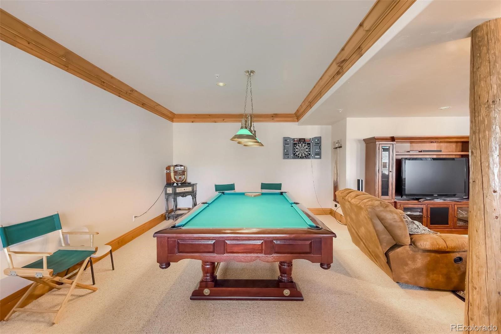 5 Fairway Lane Edwards, CO 81632 - Photo 24 of 34 a living room with furniture and a flat screen tv
