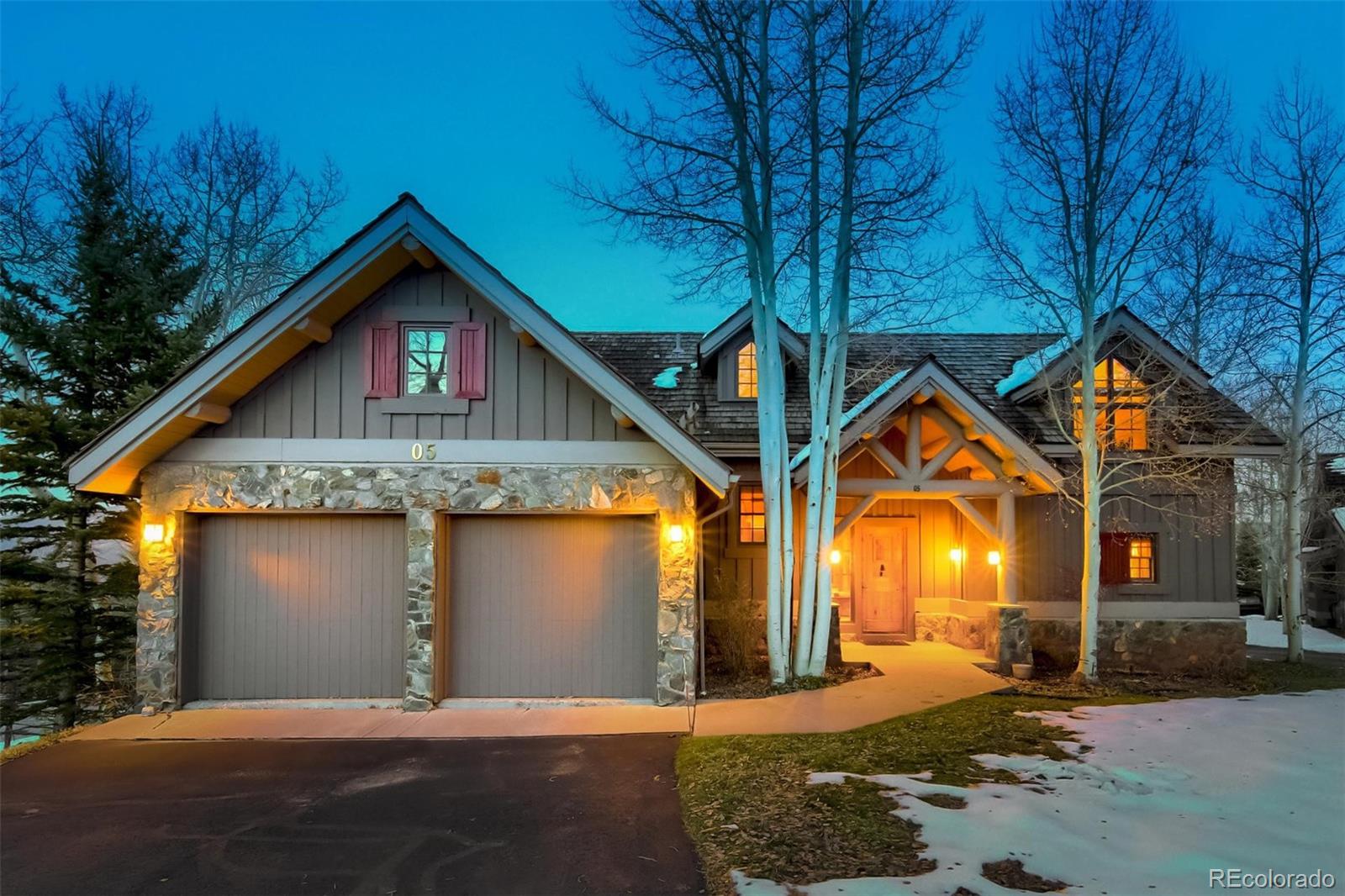 5 Fairway Lane Edwards, CO 81632 - Photo 29 of 34 a front view of a house with a yard and garage