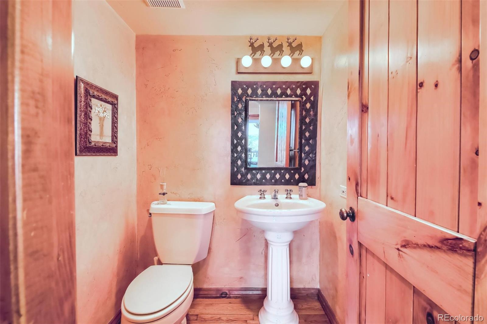 5 Fairway Lane Edwards, CO 81632 - Photo 10 of 34 a bathroom with a toilet a sink and mirror