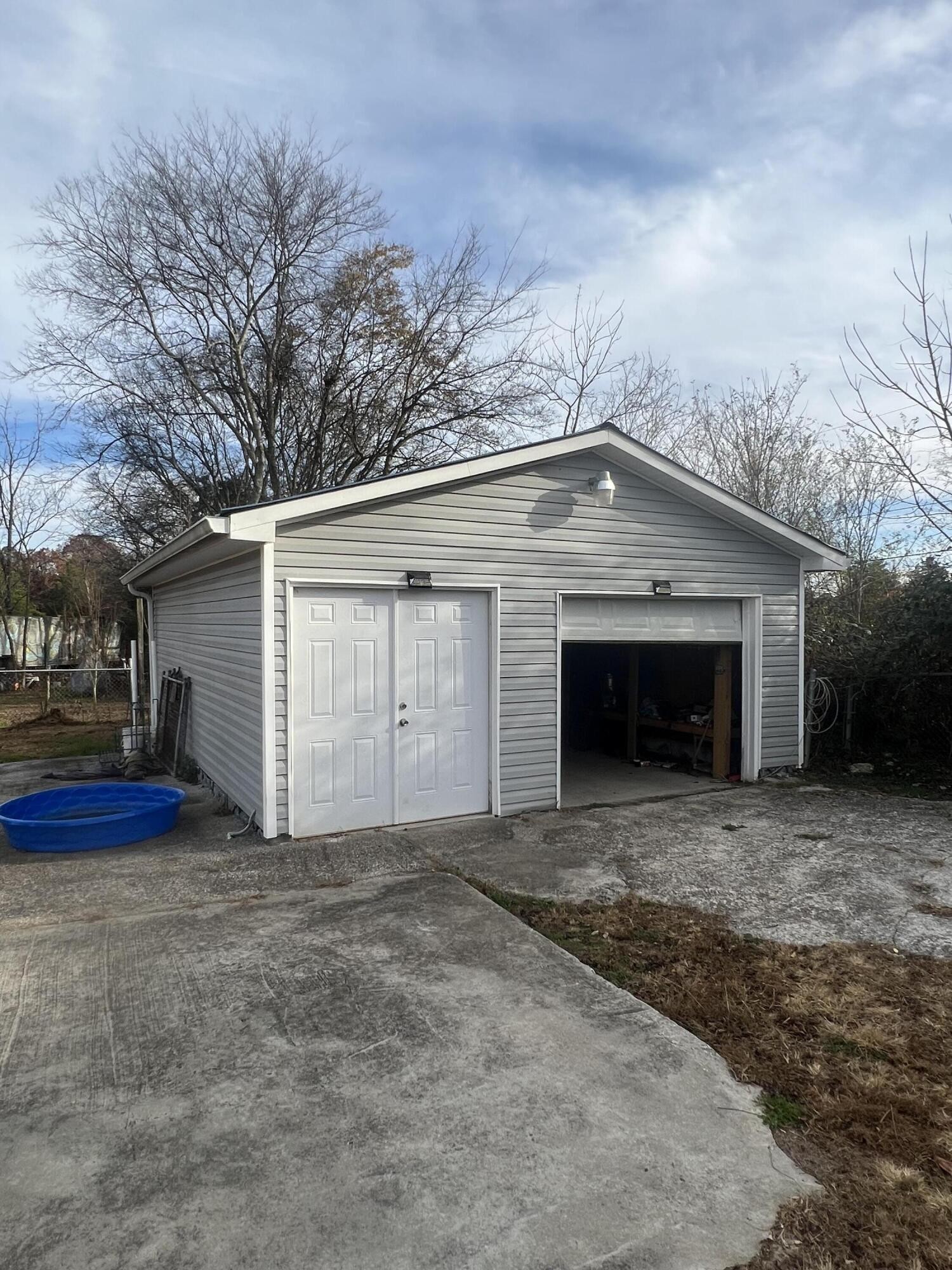 805 Durkee Road Cleveland, TN 37323 - Photo 8 of 26 a view of empty house with garage and yard
