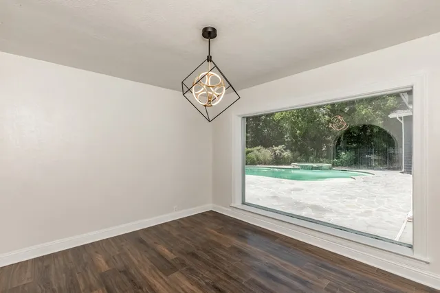 a view of a room with wooden floor wooden floor and outdoor view