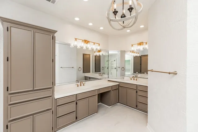 a bathroom with a double vanity sink mirror and double