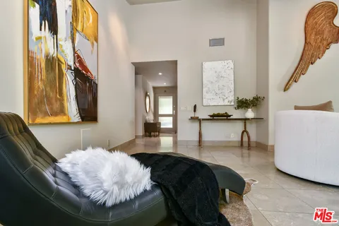 a dining room with furniture and a garden