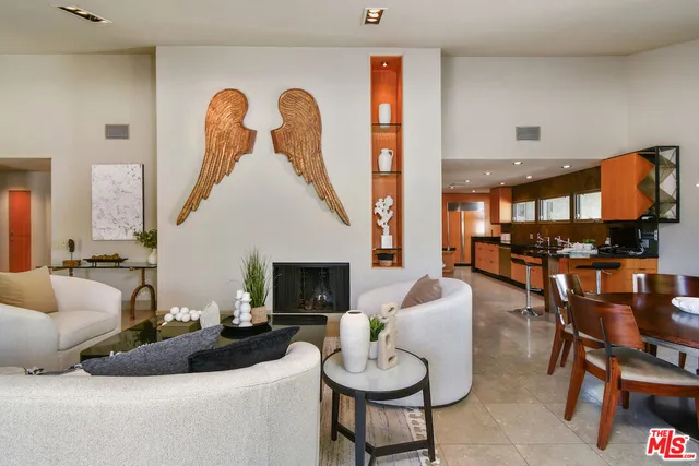 a bedroom with a bed and large window