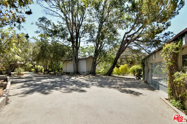 a view of a house with a tree