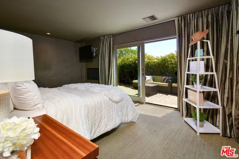 a view of a house with backyard porch and sitting area
