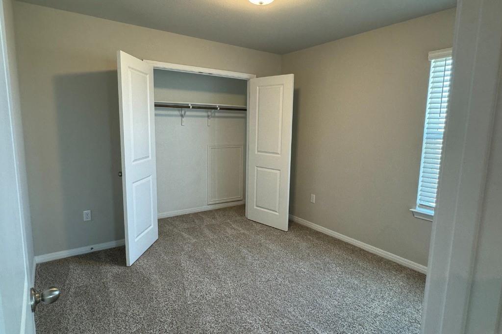 12604 Dairywork Road Buda, TX 78610 - Photo 16 of 20 An inviting sleeping space with plush carpet and ample closet storage awaits.