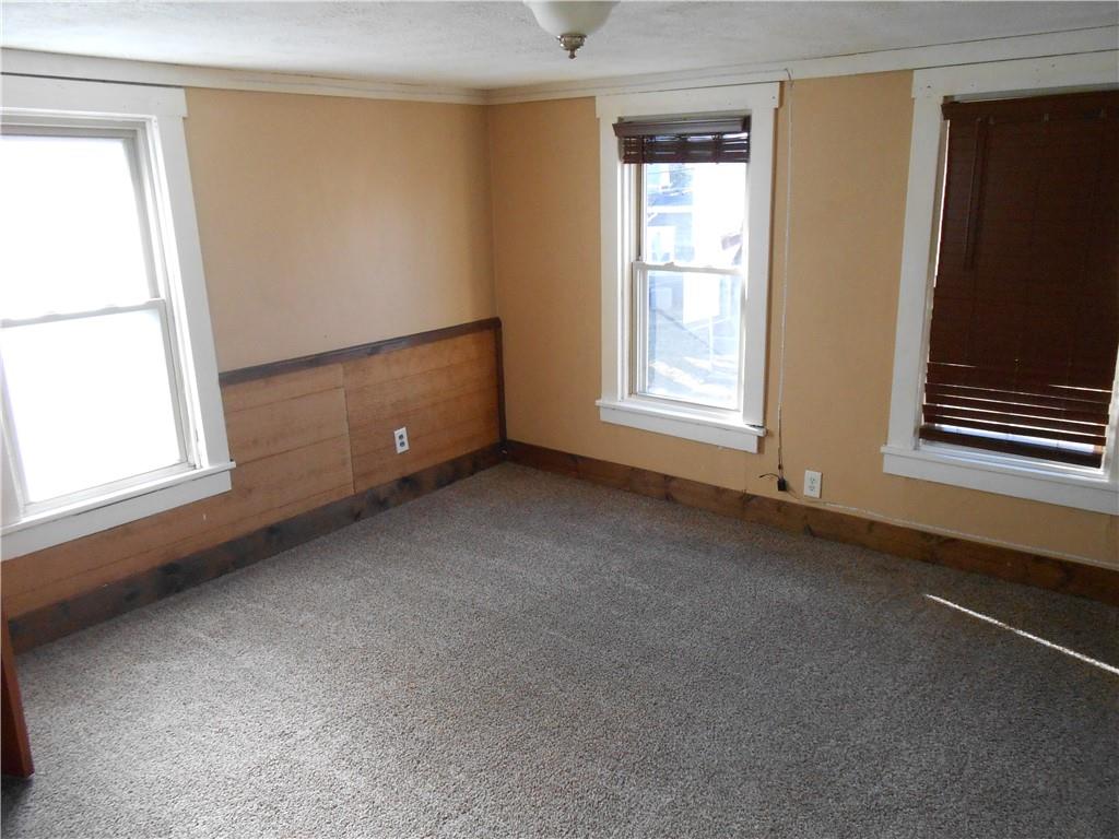 516 Oneida Street Monessen, PA 15062 - Photo 21 of 36 a view of an empty room with a window