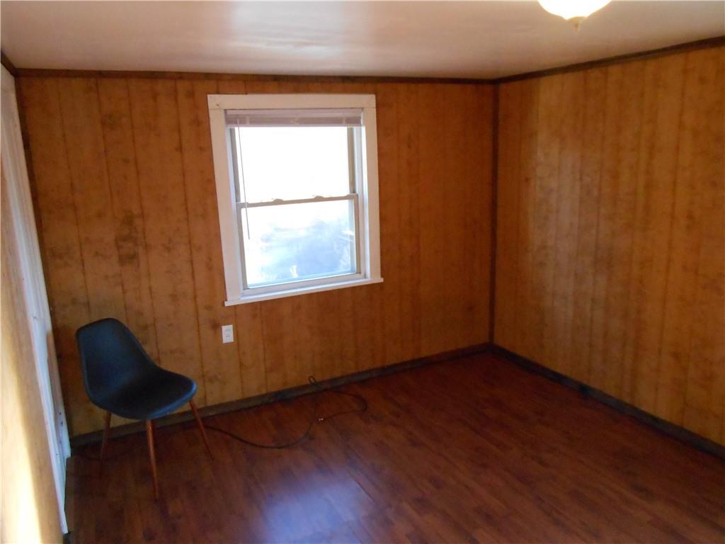 516 Oneida Street Monessen, PA 15062 - Photo 25 of 36 a view of an empty room with wooden floor and a window